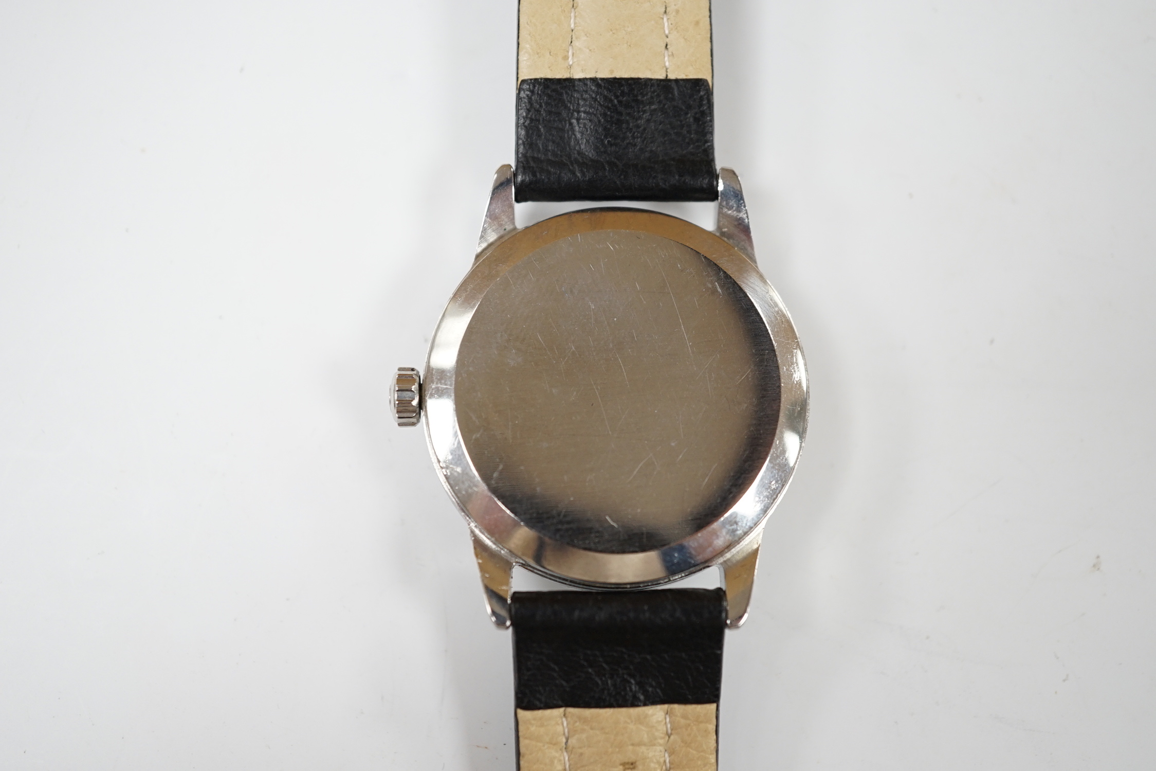 A gentleman's late 1950's stainless steel Omega manual wind wrist watch, with subsidiary seconds, on associated later leather strap, with Omega buckle, case diameter 35mm, no box or papers.